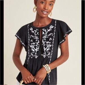 By Anthro Embroidered Flutter Sleeve Tassel Tie Jersey Knit Babydoll Peasant Top